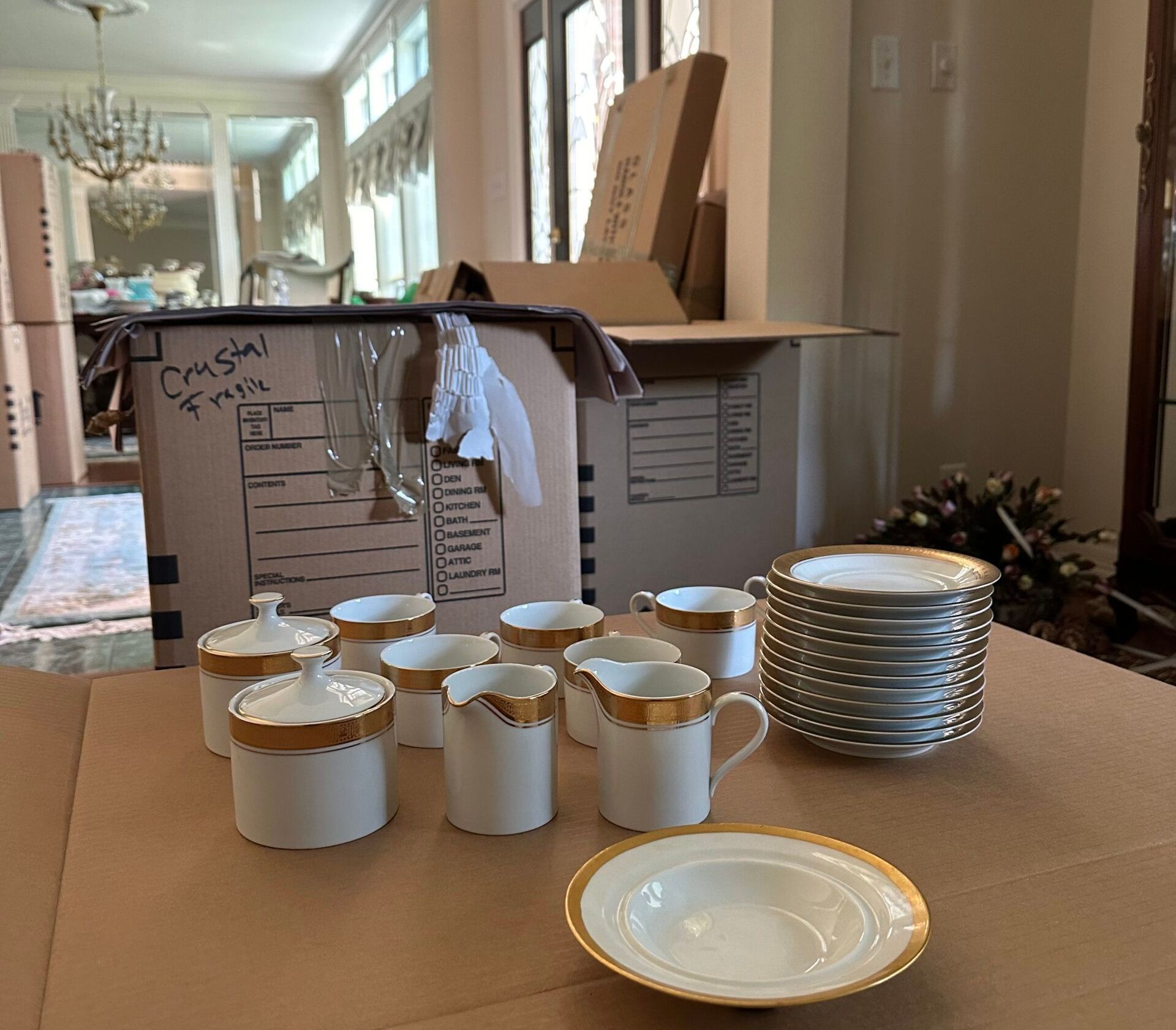 A cardboard box with a lot of plates and cups on it
